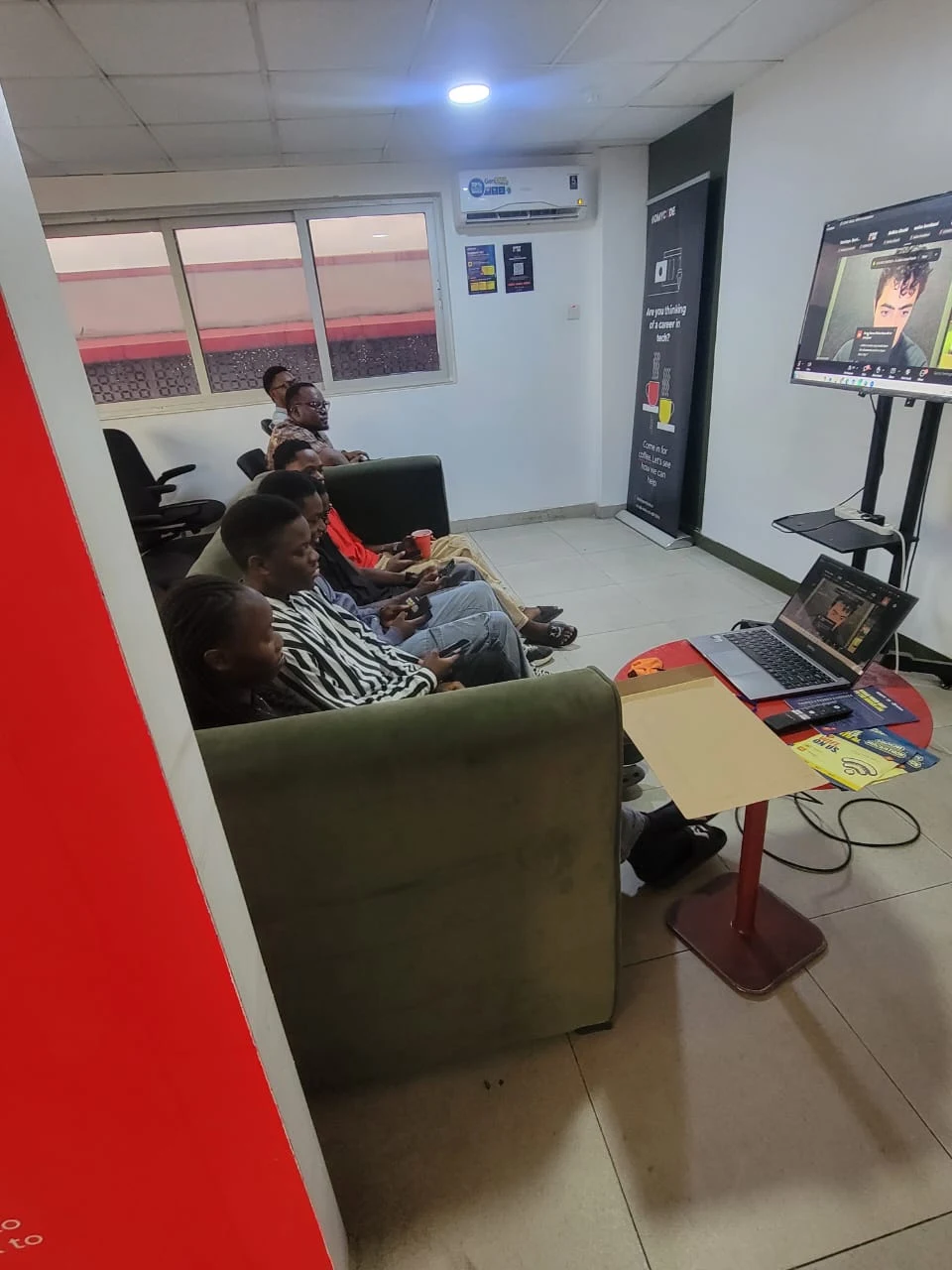 Participants following the shared event broadcast at Ikeja Hackerspace.