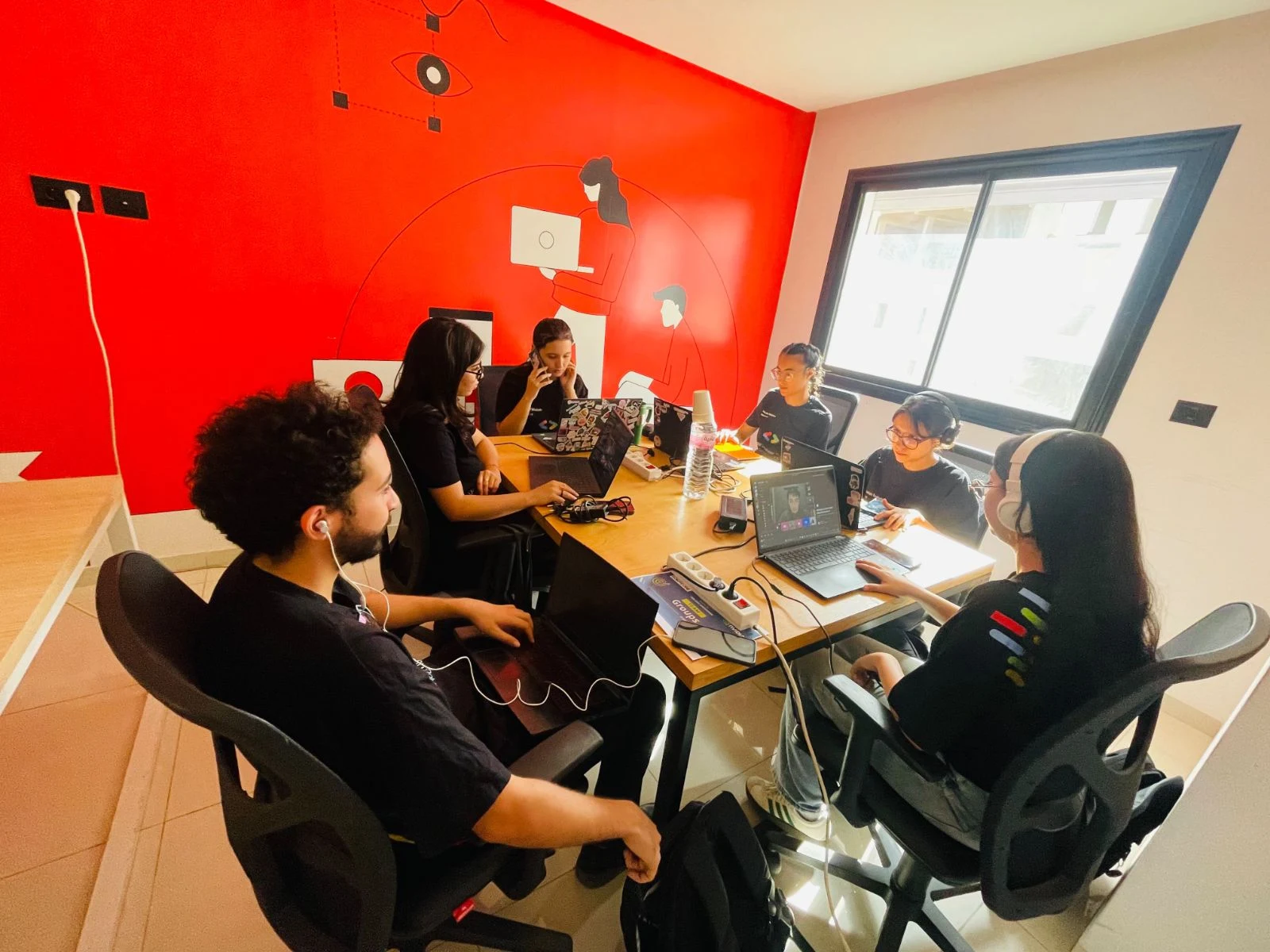 Participants building and following the hackathon at Sousse.