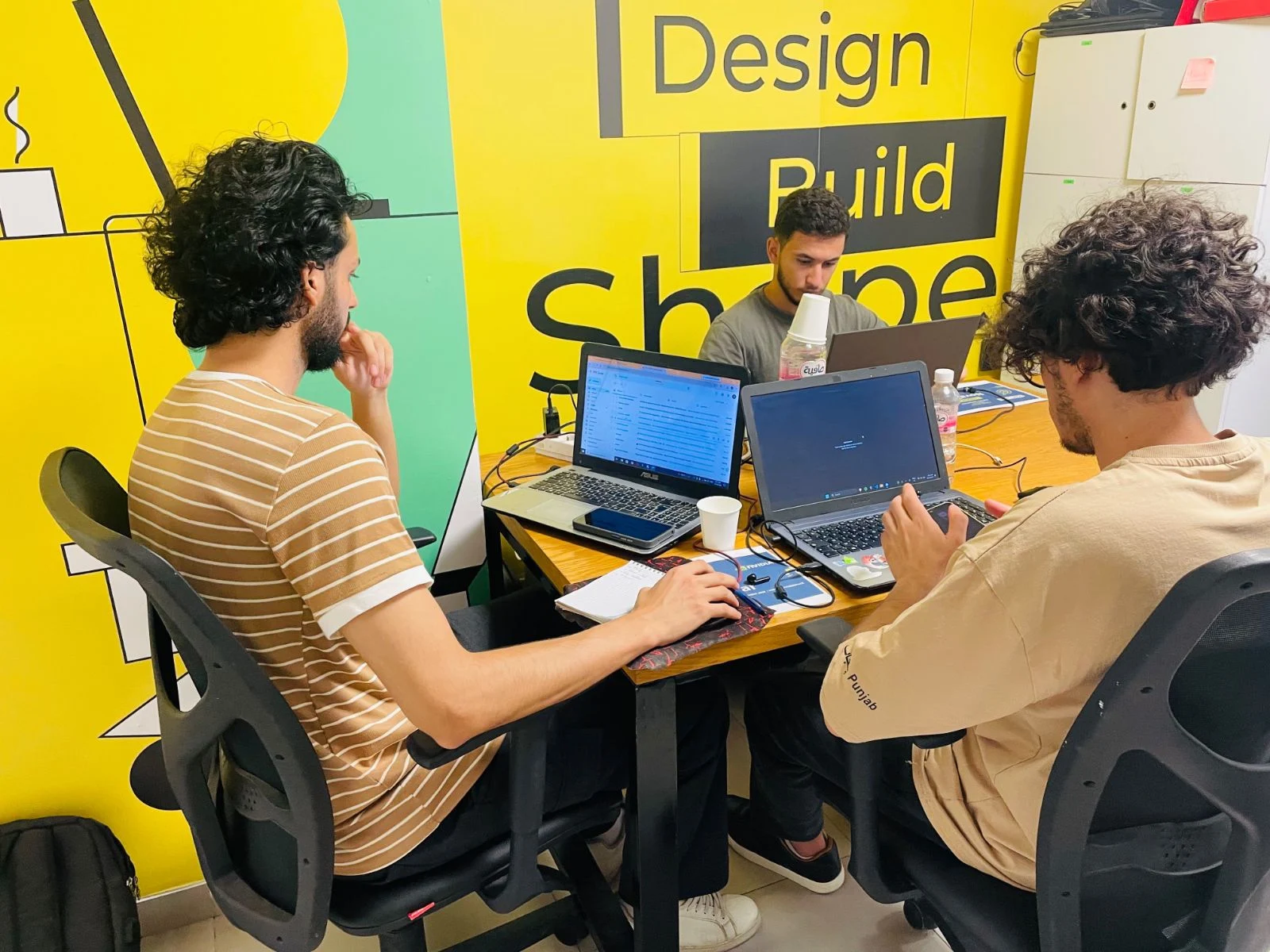 Participants building and following the hackathon at Sousse.